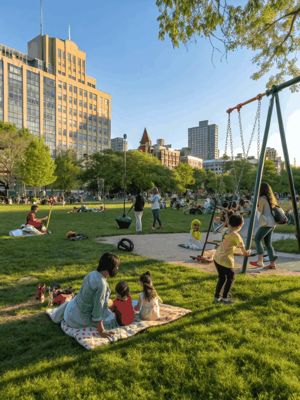 A photo of a community event organized by LES INSOMNIAKS, featuring people of all ages and backgrounds interacting and enjoying themselves, highlighting the organization's commitment to community engagement.